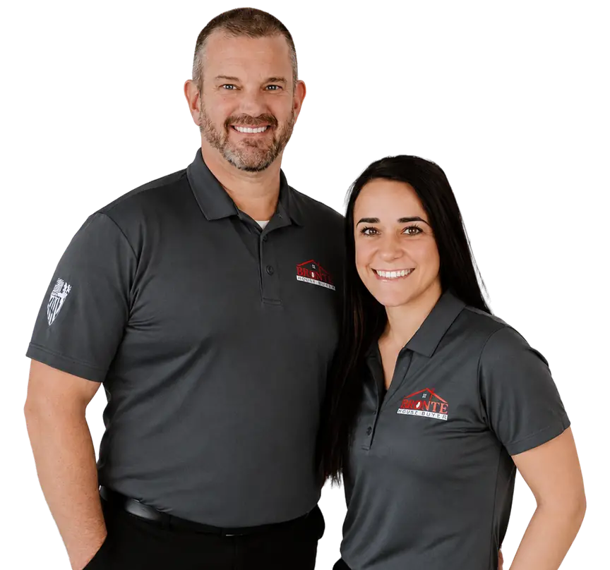 Jeremy Prunty and Cristine of Bronte House Buyer smiling together in gray company polos